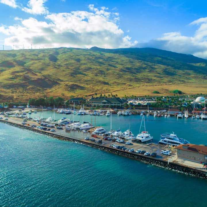 a boat is docked next to a body of water