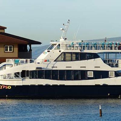 a boat is docked next to a large body of water
