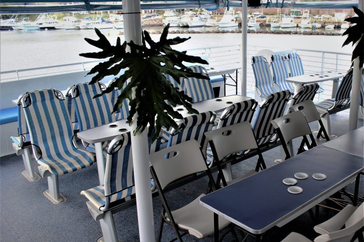 a group of people sitting at a table in a pool of water