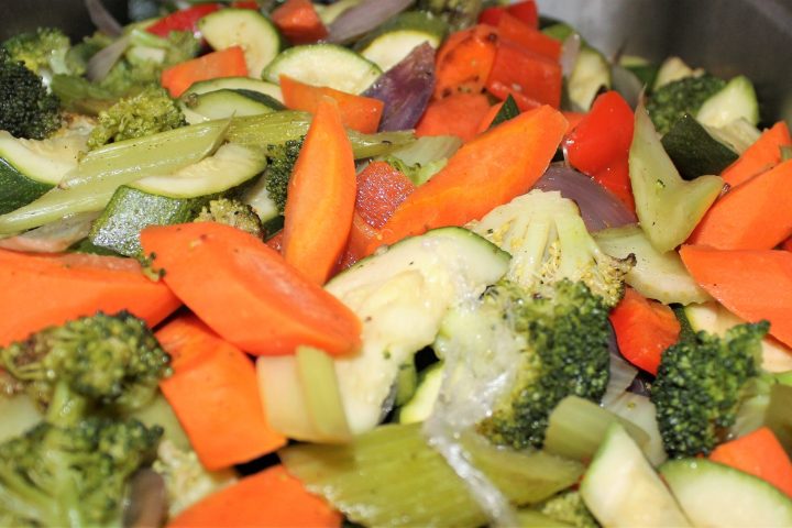 a bowl of food with broccoli